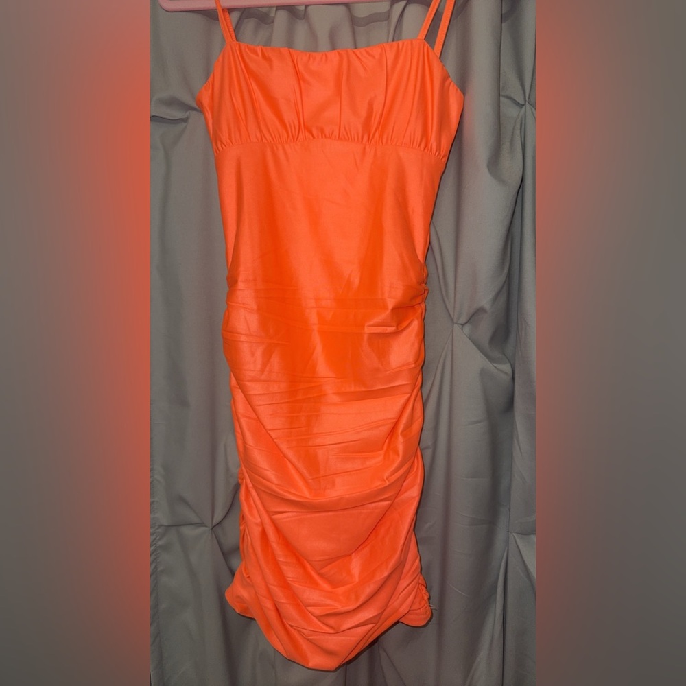 Neon Orange form fitting dress size small worn once.